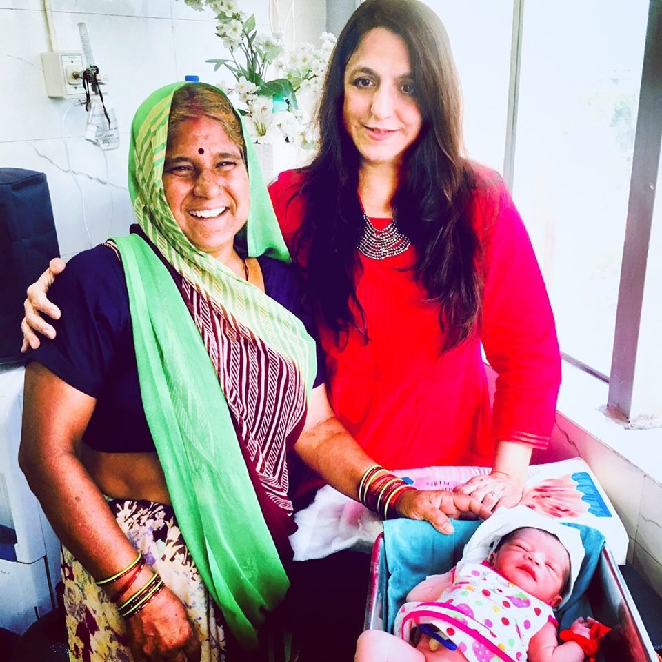 happy Indian grandmother with doctor Shivani Chaturvedi